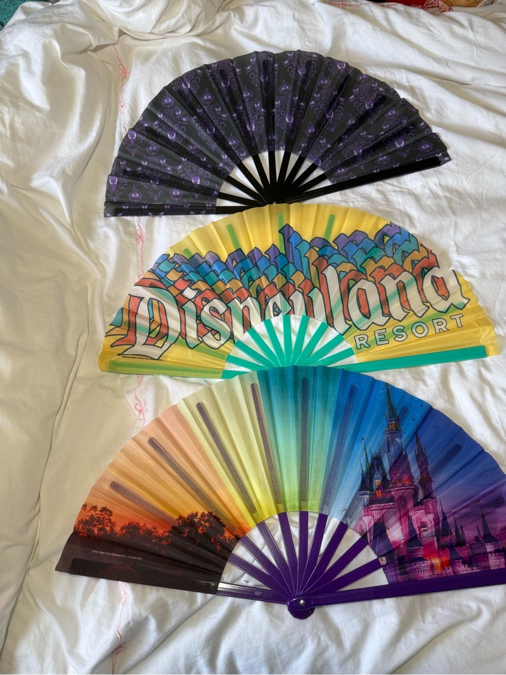 Disney Rainbow & Purple Souvenir Folding Fans - Yellow, Blue, Purple, Black